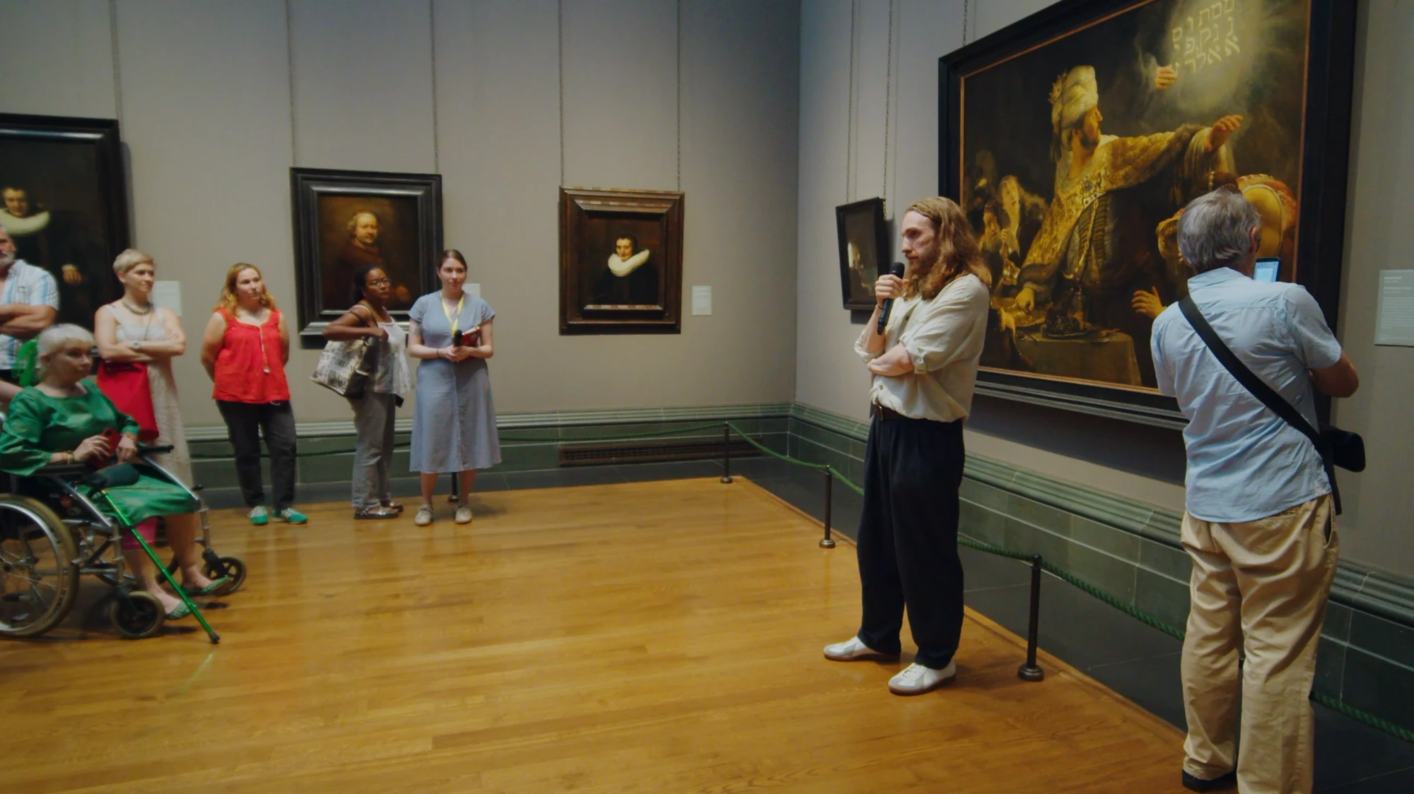 Siris Hill speaking in the Rembrandt Room at the National Gallery